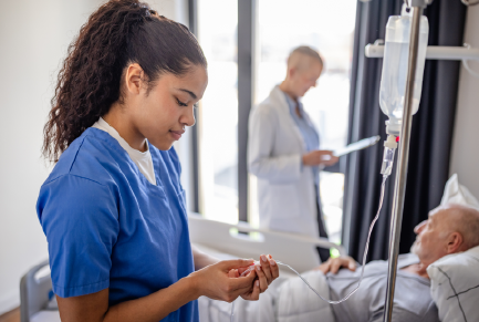 Nurse preparing IV fluids for patient